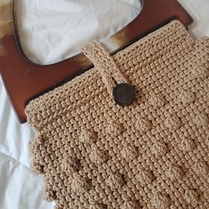 Neutral crochet purse with plastic purse handles